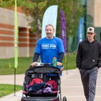 Participants with stroller nearing finish line